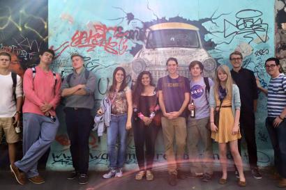 Some IES students in front of a wall with a Trabant painted on it.