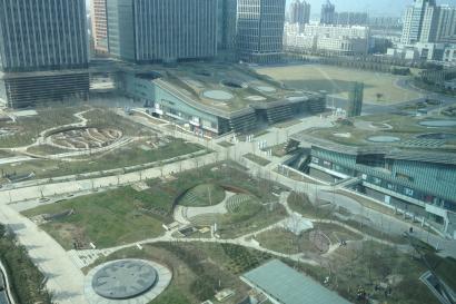 Colorful tower lit at night near a waterway. This alt text was added with Al; accuracy may vary.