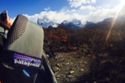 The Patagonia logo with the mountains in the background 