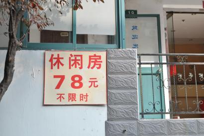 Dog resting with paws crossed on a blanket. This alt text was added with Al; accuracy may vary.