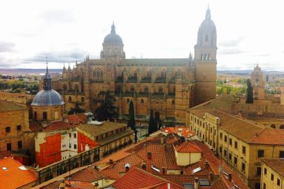 Mexican chocolate discs with intricate designs in brown and black wrappers. This alt text was added with Al; accuracy may vary.