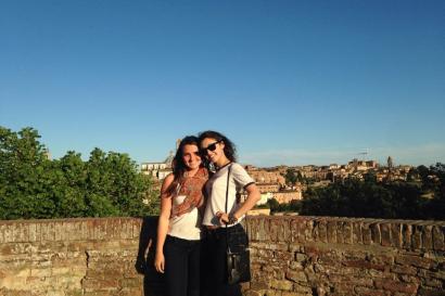 Woman with dark hair indoors, softly smiling. This alt text was added with Al; accuracy may vary.