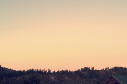 1. Two people walking by the sea under a cloudy sky.
2. Crowd at a park festival with tents and trees.
3. Evening sky with the moon above a rural landscape. This alt text was added with Al; accuracy may vary.