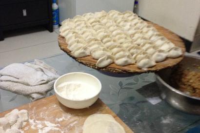 Ornate Chinese temple facade with colorful carvings and statues. This alt text was added with Al; accuracy may vary.