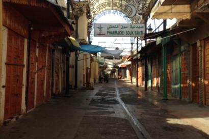 A group of people on a beach at sunset, posing and smiling. This alt text was added with Al; accuracy may vary.