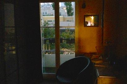 A brightly colored double-decker bus in a city setting with a historic building. This alt text was added with Al; accuracy may vary.