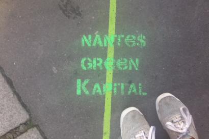 Canal in Amsterdam with boats and traditional houses under a blue sky. This alt text was added with Al; accuracy may vary.