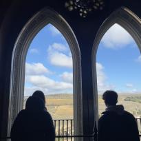 Peers looking out the Segovia castle's window