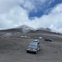 picture of mountains in cotopaxi with a vehicle