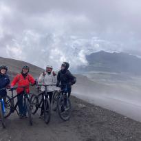group of students pictured on their bikes with fog in background