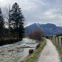 walking along a river with view of the mountains