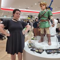 Author, Macks, posing with Link from Legend of Zelda in the Nintendo store.