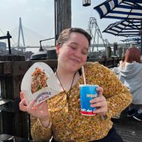 Author, Macks, posing with food and a drink in Universal Studios, Japan.