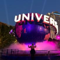 Author, Macks, standing in front of the Universal Globe in Universal Studios, Japan.