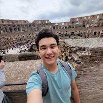 Shown is a selfie of me in the Roman Colosseum