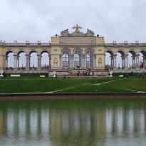 Shown is a monument at the Schonbrunn Palace by a small pond