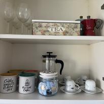 cute coffee mugs & moka pots in airbnb kitchen  