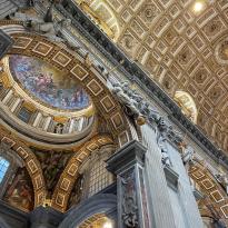 Gold and painted arched ceilings in St Peter's Basilica