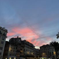 Pink sunset over some buildings in Rome