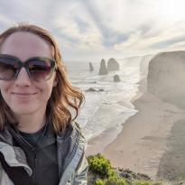 A selfie of me smiling in front of the twelve apostles rock formations off the south coast of Australia 