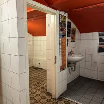 a white and orange bathroom
