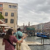 Two people facing away from the camera in venice