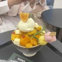 Image of bingsu, Korean dessert, with sweet cream and mango 