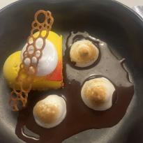 Dessert from a restaurant in Florence, citrus tart, chocolate, and meringue 