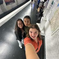 A .5 selfie of my 2 friends and I in the Paris metro waiting for our train.