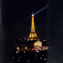The Eiffel Tower lit up from the top of the Ferris Wheel in the Paris Fair