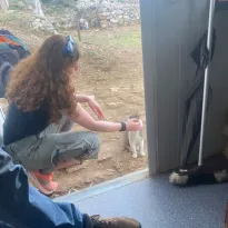 Ginger lady petting a cat and losing her mind over it... internally obviously