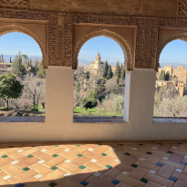 Alhambra seen through three window arches