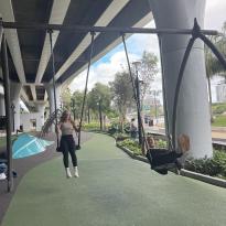 Two friends on swings in Brisbane 