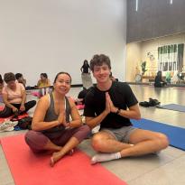 my and my host mother in criss-cross applesauce sitting on yoga mats
