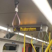 Digital signage on subway showing which station is next, and which side to leave from