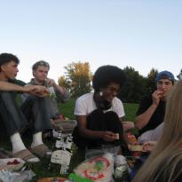 People sitting on ground for picnic