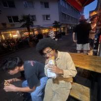 Person eating on a bench