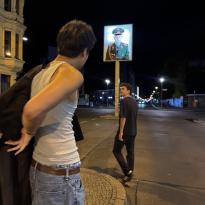 Two people standing on the street