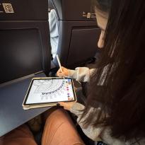 A Girl playing iPad games