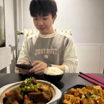 Someone eating food at a table