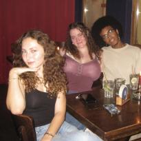 Three friends at a bar