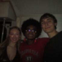 Three friends posing for a photo