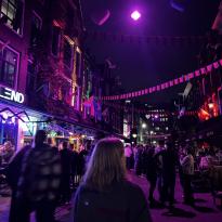 A street with banners hanging between houses