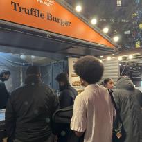 Man in line for a truffle burger