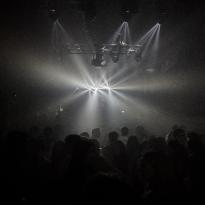 A bright light and shadows of people