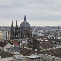 A photo of Vienna's Maria vom Siege, from far away, swimming in the city of Vienna.