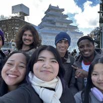 The entire group who went to Hokkaido posing in front of a snow sculpture of Aizu Tsurugajo Castle