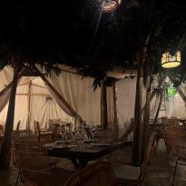 Tables and surrounding decor inside Voltereta Bali