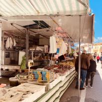 Stalls selling meats, cheeses and nuts in the Calitri market