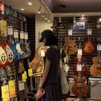 A friend of mine looking at very decorative guitars.